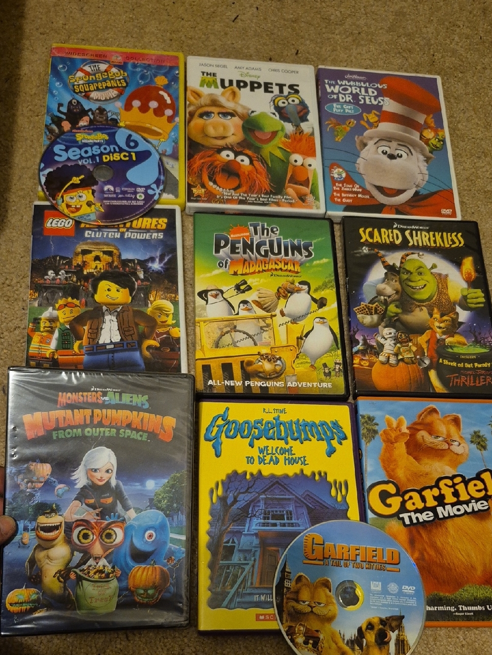 Kids DVD Movie Lot - (Garfield, Goosebumps, Penguins, Spongebob, Lego)